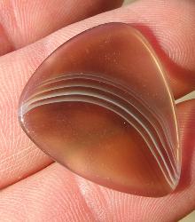 stone guitar pick made out of Botsaanna agate